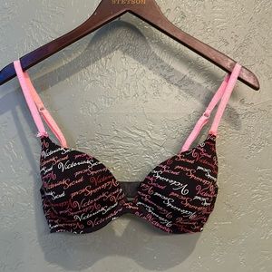 Victoria Secret bra. Black with pink white & red text, matching panty